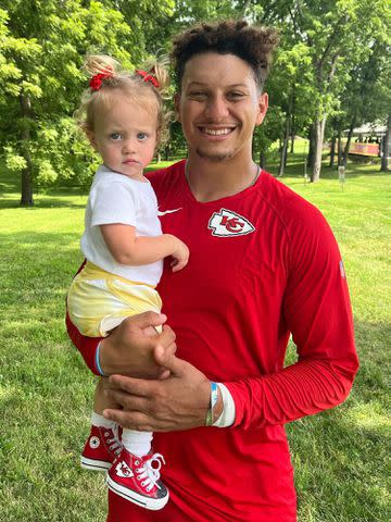 Brittany Mahomes Instagram Patrick Mahomes holding his daughter Sterling.