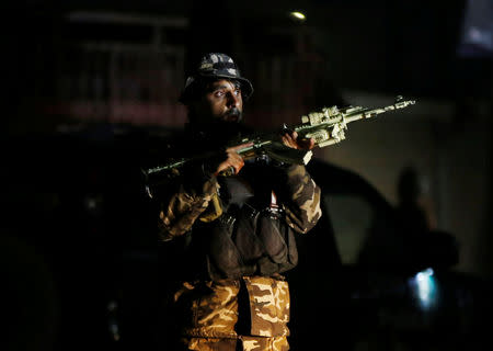 A member of Afghan security force takes position at the site of an attack in Kabul, Afghanistan December 24, 2018.REUTERS/Omar Sobhani