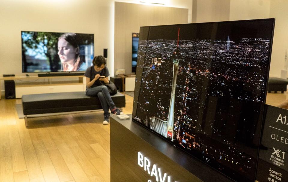 OLED TV sets in a Sony store.  During the May Day golden...