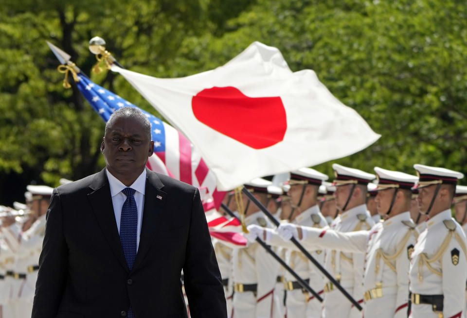 U.S. Defense Secretary Lloyd Austin reviews the guard of honor at the Defense Ministry in Tokyo Thursday, June 1, 2023. (Franck Robichon/Pool Photo via AP)