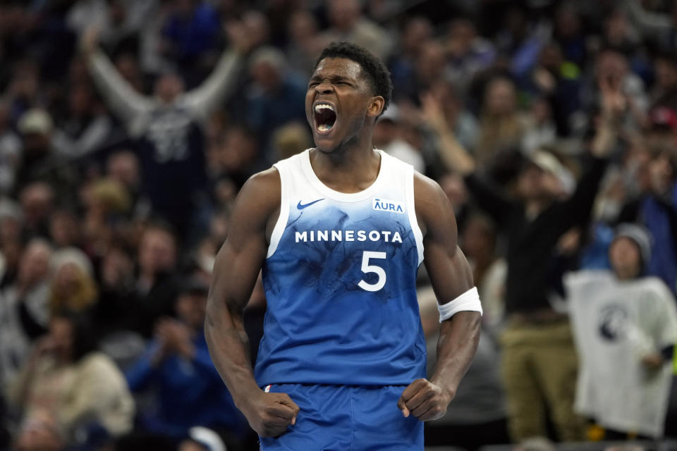 Minnesota Timberwolves guard Anthony Edwards (5) celebrates after making a three-point basket during the second half of an NBA basketball In-Season Tournament game against the Oklahoma City Thunder, Tuesday, Nov. 28, 2023, in Minneapolis. (AP Photo/Abbie Parr)