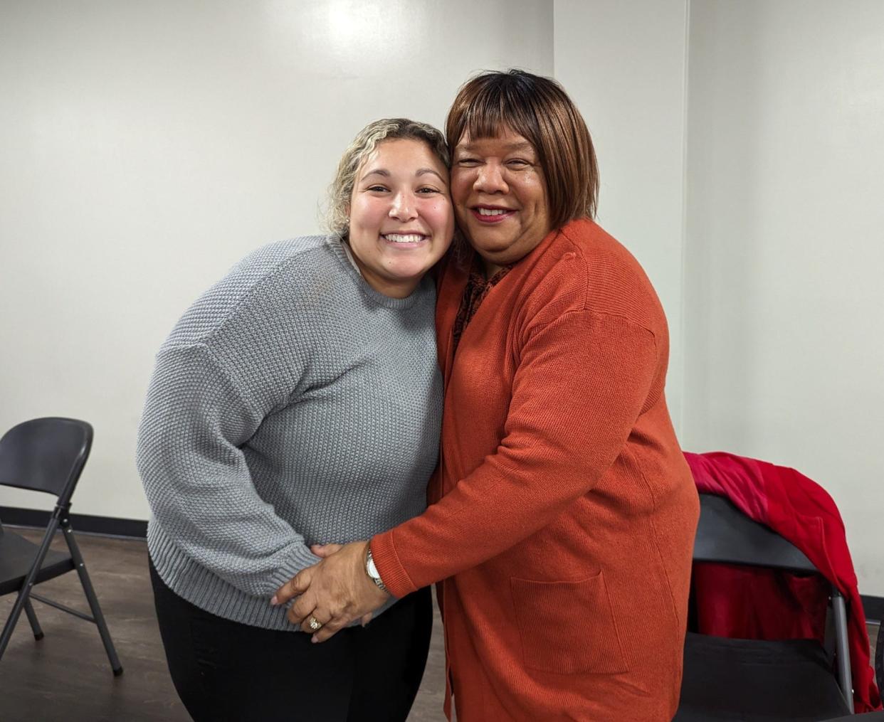 Malone University student Mykayla Askew, left, and Patty Stokes Williams, who grew up in southeast Canton, embrace. Askew interviewed Williams for a student research project examining how urban renewal upended the neighborhood.