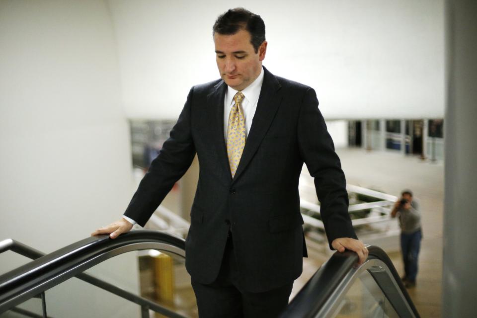 U.S. Senator Ted Cruz (R-TX) arrives in the subway for a vote whether to raise the debt ceiling at the U.S. Capitol in Washington February 12, 2014. Legislation to extend U.S. federal borrowing authority for a year cleared a critical procedural hurdle in the Senate on Wednesday, moving the measure to a final vote. REUTERS/Jonathan Ernst (UNITED STATES - Tags: POLITICS BUSINESS)