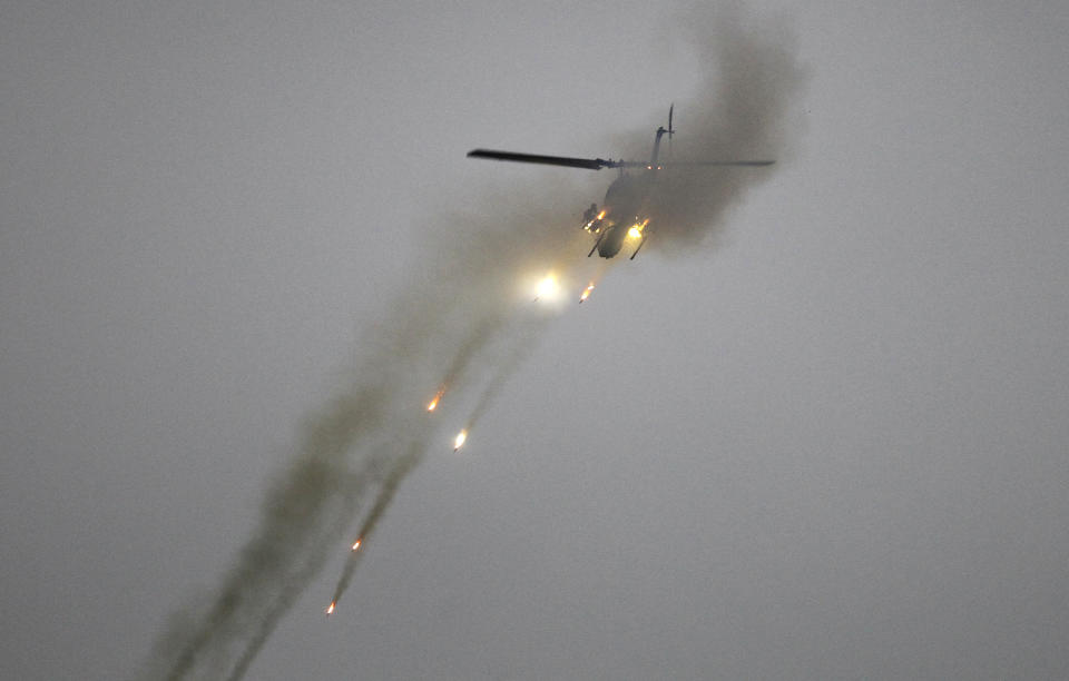 Taiwan's AH-1W Cobra attack helicopter fires during a military exercises in Taichung, central Taiwan, Thursday, Jan. 17, 2019. Taiwan’s military has conducted a live-fire drill on Thursday to show its determination to defend itself from Chinese threats. (AP Photo/Chiang Ying-ying)