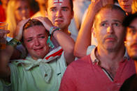 <p>England fan looks dejected after the match. REUTERS/Simon Dawson </p>