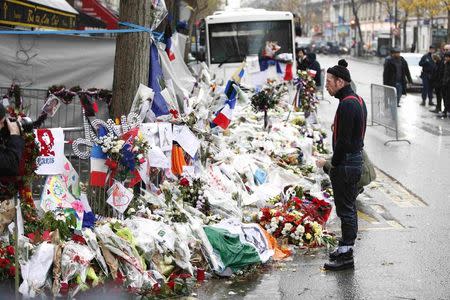 Jesse Hughes, member of Eagles of Death Metal band, mourns in front of the Bataclan concert hall to pay tribute to the shooting victims in Paris, France, December 8, 2015. REUTERS/Charles Platiau