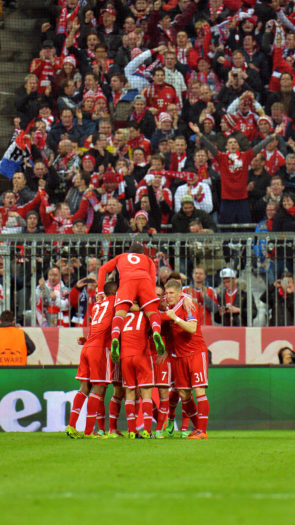 Bayern's players celebrate after scoring during the Champions League round of the last 16 second leg soccer match between FC Bayern Munich and Arsenal FC in Munich, Germany, on Tuesday, March 11. 2014. (AP Photo/Kerstin Joensson)