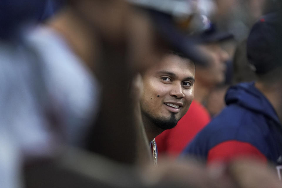 Minnesota Twins' Luis Arraez smiles on the bench during the eighth inning of a baseball game against the Chicago White Sox Wednesday, Oct. 5, 2022, in Chicago. (AP Photo/Nam Y. Huh)