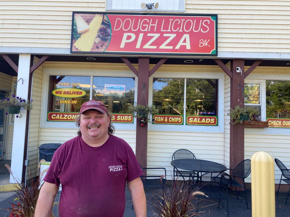 Dough Licious Pizza owner Bill Russell said he loves his job, seen here outside the Berkley pizzeria on Sept. 21, 2021.