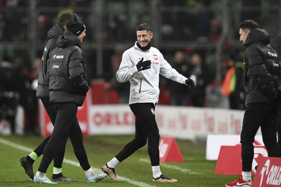 Poland's Robert Lewandowski, center, leaves after an international friendly soccer match between Poland and Chile at the Polish Army Stadium in Warsaw, Poland Wednesday, Nov. 16, 2022. (AP Photo/Rafal Oleksiewicz)