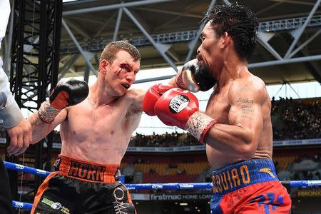 Boxing - Manny Pacquiao v Jeff Horn - WBO World Welterweight Title - Brisbane, Australia - July 2, 2017. Jeff Horn of Australia punches Manny Pacquiao of the Philippines. AAP/Dave Hunt/via REUTERS
