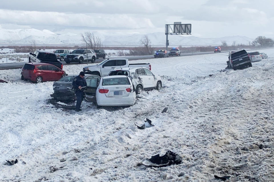 An officer responds to a multi-car pileup on I-580 in Washoe Valley, Nev., on Sunday after severe weather hit the region. (Truckee Meadows Fire & Rescue)