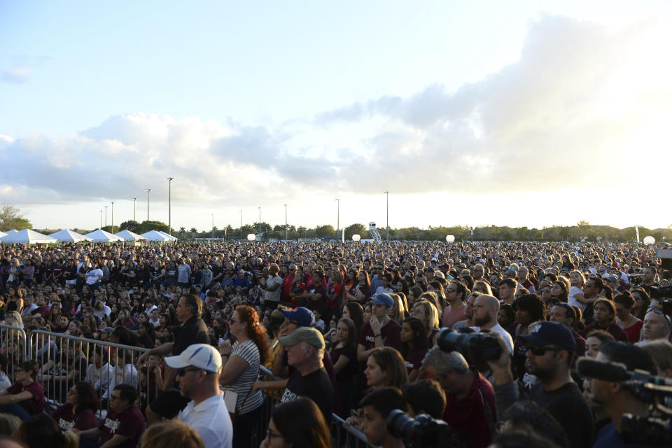 PARKLAND FL - FEBRUARY 14: Students and parents attend a memorial service at Pine Trails Park for the victims of the mass shooting at Marjory Stoneman Douglas High School on Valentines Day 2018 in Parkland, Florida. A year ago on Feb, 14th at Marjory Stoneman Douglas High School where 14 students and three staff members were killed during the mass shooting. on February 14, 2019 in Parkland, Florida. Credit: mpi04/MediaPunch /IPX