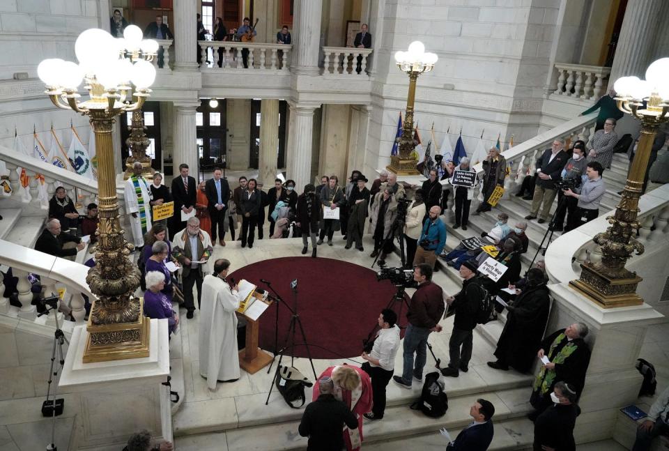 Several dozen people took part in Wednesday's vigil, which included remarks by Lt. Gov. Sabina Matos and the majority leaders of the House and Senate.