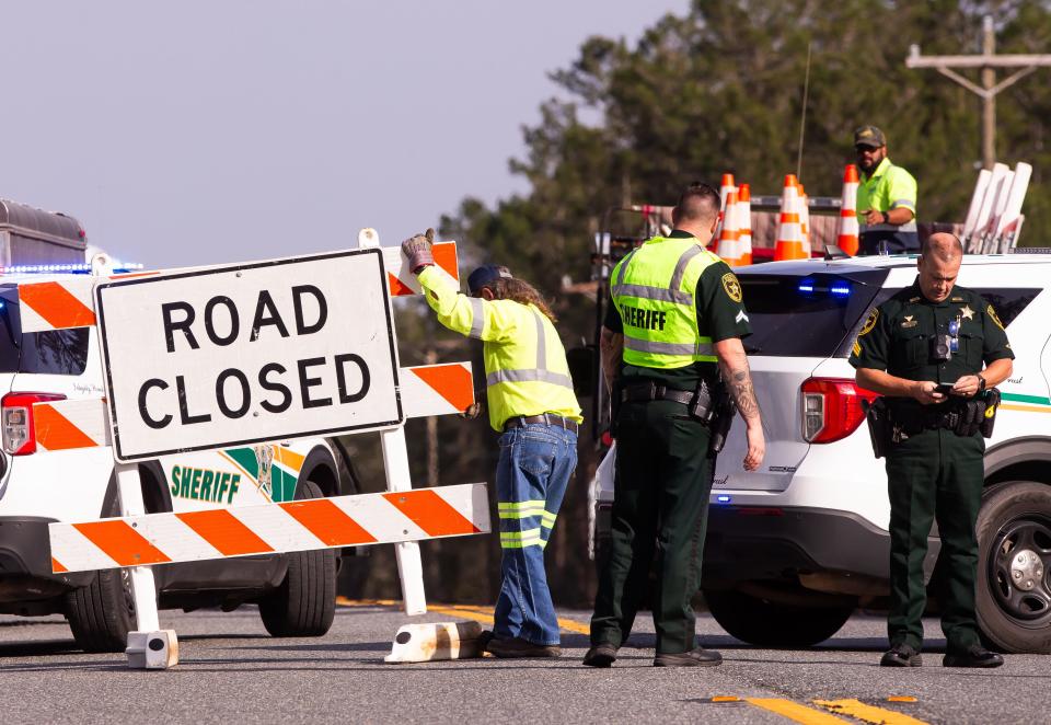 Marion County Sheriff’s Office deputies investigate the site of a fatal crash on Feb. 1 involving a stolen patrol vehicle on State Road 40 in Ocala.