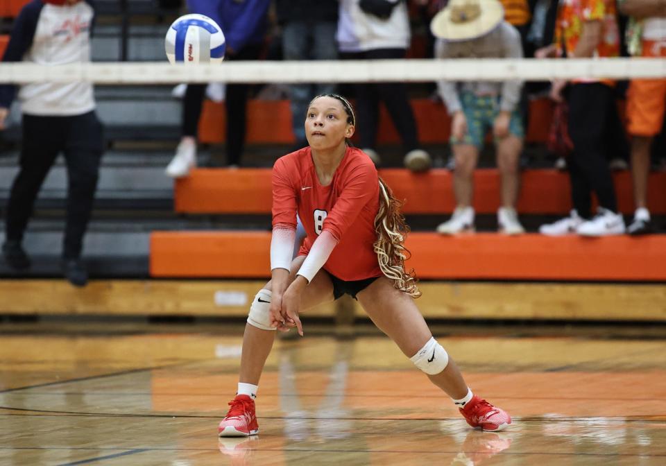 Malea Wourman recturns a serve against Ida during Milan's 25-13, 25-15, 25-18 victory Tuesday in the semifinals of the Division 2 Volleyball Regional at Tecumseh.