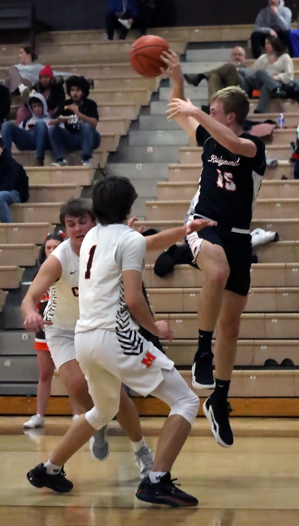 Ridgewood's Grant Lahmers (15) passes the ball during the Colts versus Generals basketball game Tuesday evening at Meadowbrook High School.