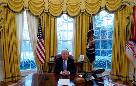 U.S. President Donald Trump listens during an interview with Reuters at the White House in Washington, U.S., January 17, 2018. REUTERS/Kevin Lamarque