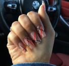 <p>Add lines to your next manicure to spice up your look. Don't be afraid to try a <a href="https://www.goodhousekeeping.com/beauty/nails/a33451/nail-shapes-and-names-manicure/" rel="nofollow noopener" target="_blank" data-ylk="slk:different nail shape;elm:context_link;itc:0;sec:content-canvas" class="link ">different nail shape</a>, just be sure to stay on-brand with blue and red colors. </p><p><a href="https://www.amazon.com/Sticker-Stripe-Stickers-Adhesive-Striping/dp/B07SCKCSDC/ref=sr_1_53?crid=39J125X9RTMG0&keywords=stencil+line+for+nail+art&qid=1653260889&sprefix=stencil+line%2Caps%2C56&sr=8-53&tag=syn-yahoo-20&ascsubtag=%5Bartid%7C10055.g.1278%5Bsrc%7Cyahoo-us" rel="nofollow noopener" target="_blank" data-ylk="slk:SHOP LINE DECALS;elm:context_link;itc:0;sec:content-canvas" class="link ">SHOP LINE DECALS</a></p>