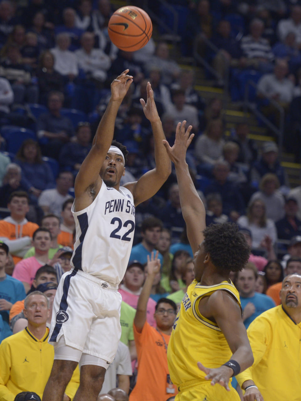 Penn State's Jalen Pickett (22) shoots over Michigan's Tarris Reed Jr. ,right, during the first half of an NCAA college basketball game, Sunday, Jan. 29, 2023, in State College, Pa. (AP Photo/Gary M. Baranec)