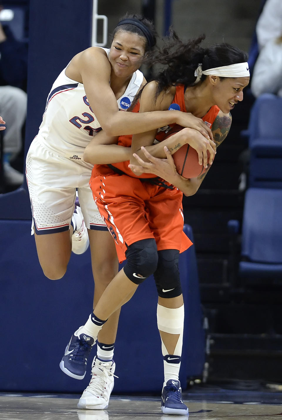 Connecticut's Napheesa Collier, left, and Syracuse's Briana Day, right, compete for a rebound during the second half of a second-round game in the NCAA women's college basketball tournament, Monday, March 20, 2017, in Storrs, Conn. (AP Photo/Jessica Hill)