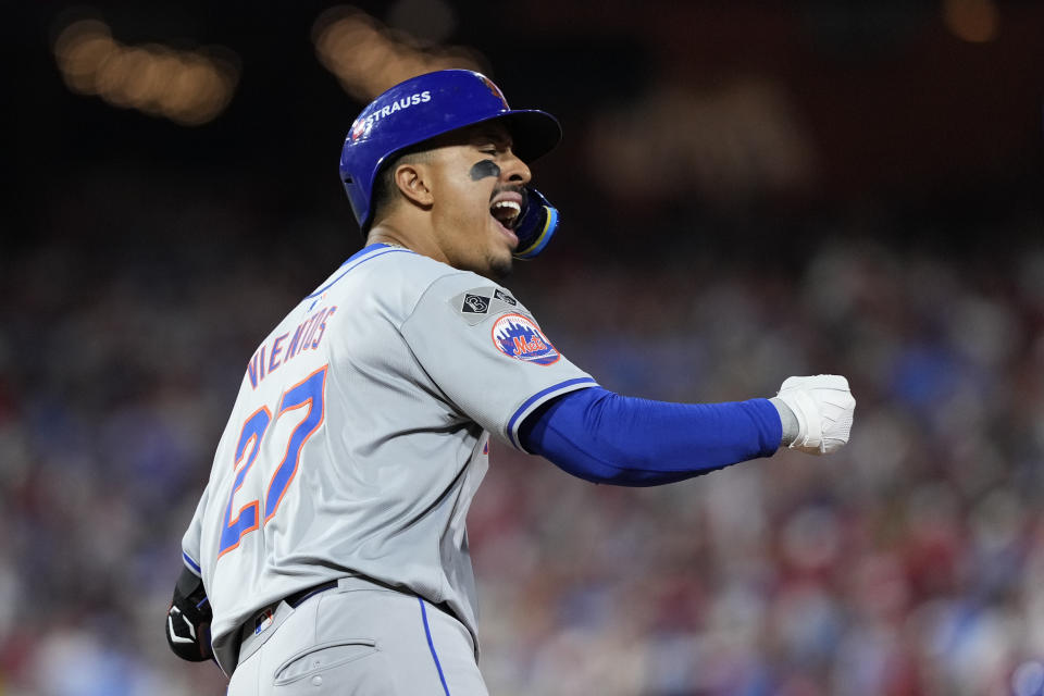 New York Mets' Mark Vientos reacts after hitting a two-run home run against Philadelphia Phillies pitcher Matt Strahm during the ninth inning of Game 2 of a baseball NL Division Series, Sunday, Oct. 6, 2024, in Philadelphia. (AP Photo/Matt Slocum)