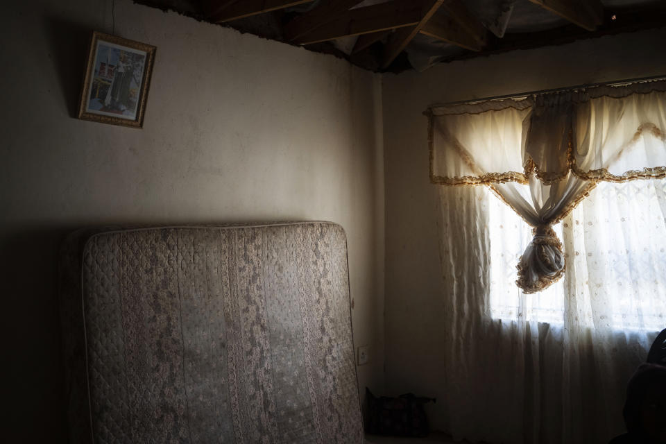 The mattress on which 12-year-old Onthatile Mohapi once slept leans against the wall of his bedroom in Damonsville, South Africa, on June 8, 2020. Mohapi's body was found in a dam 7 kilometers from his home. The pathology report said the boy drowned, but his mother believes he was murdered. (AP Photo/Bram Janssen)