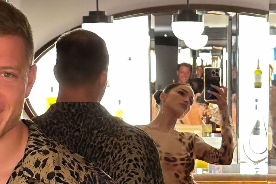 <p>Olivia Culpo/Instagram</p> Olivia Culpo and Christian McCaffrey wear matching leopard print outfits.