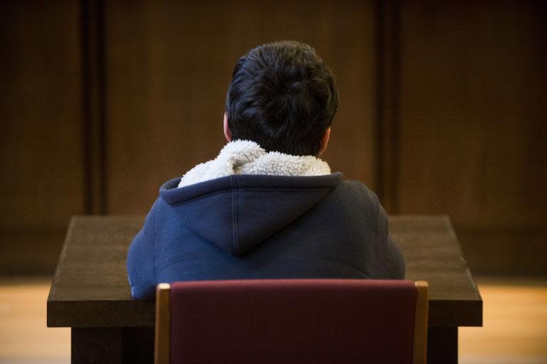 A 14-year-old Austrian schoolboy convicted of planning to bomb a Vienna train station in the name of the Islamic State group attends his trial on May 26, 2015, in St Poelten, Austria