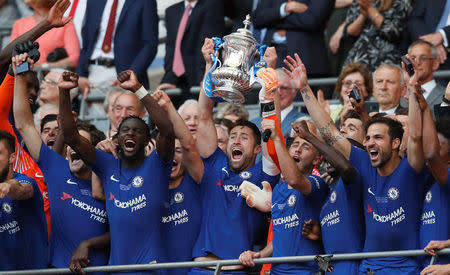 Soccer Football - FA Cup Final - Chelsea vs Manchester United - Wembley Stadium, London, Britain - May 19, 2018 Chelsea's Gary Cahill lifts the trophy as they celebrate winning the final REUTERS/David Klein