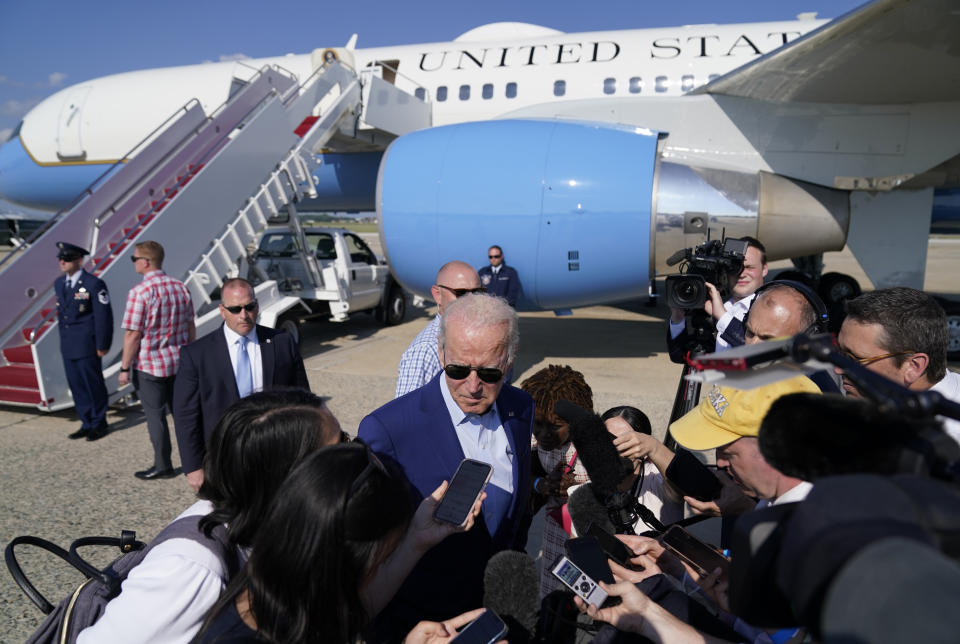 President Joe Biden speaks to members of the media after exiting Air Force One, Wednesday, July 20, 2022, at Andrews Air Force Base, Md. Biden is returning from a trip to Somerset, Mass., where he spoke about climate change. (AP Photo/Evan Vucci)