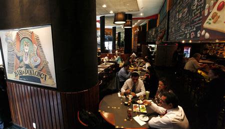 People lunch at Bar da Dona Onca restaurant in Sao Paulo April 24, 2014. REUTERS/Paulo Whitaker