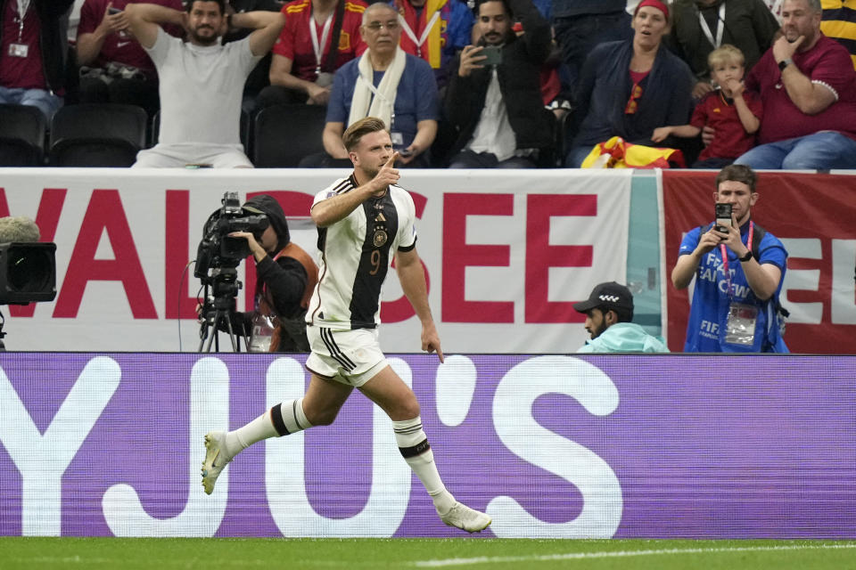 Germany's Niclas Fuellkrug celebrates after scoring his side's first goal during the World Cup group E soccer match between Spain and Germany, at the Al Bayt Stadium in Al Khor , Qatar, Sunday, Nov. 27, 2022. (AP Photo/Matthias Schrader)