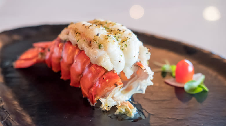 Cooked lobster tail on tray