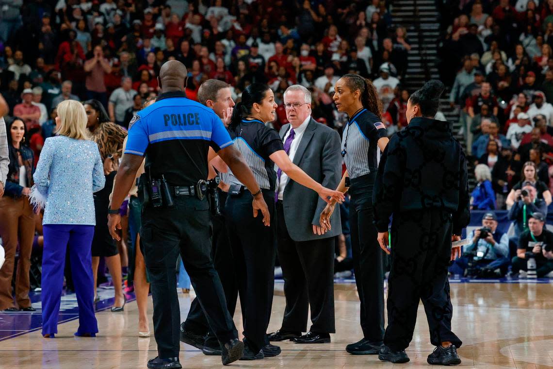 Police stand on court in the aftermath of an altercation on court with LSU players during the second half of action in the SEC Tournament Championship game at Bon Secours Wellness Arena in Greenville on Sunday, Mar. 10, 2024.