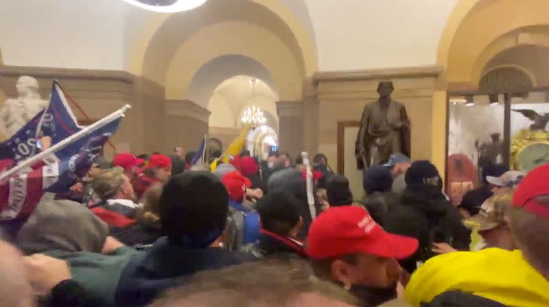 FILE PHOTO: Supporters of U.S. President Donald Trump storm the Capitol in Washington