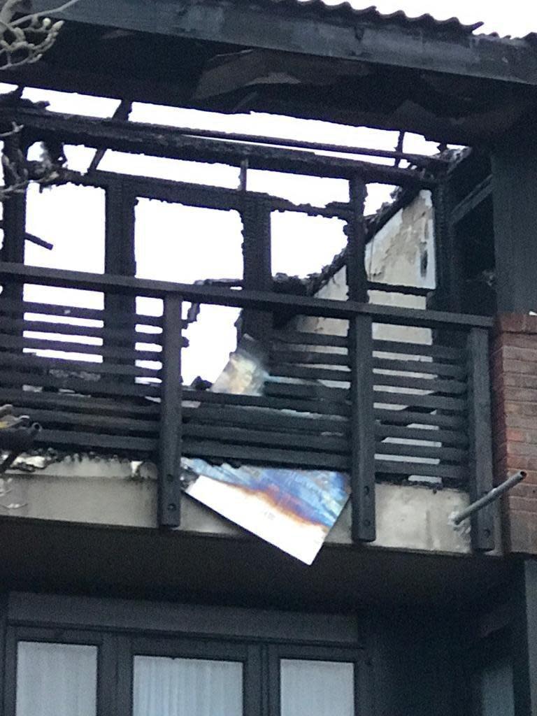 The wreckage of the top floor flat in the West End Sidings estate after the fire