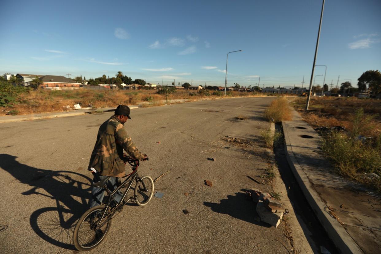 A man walking with a bicycle