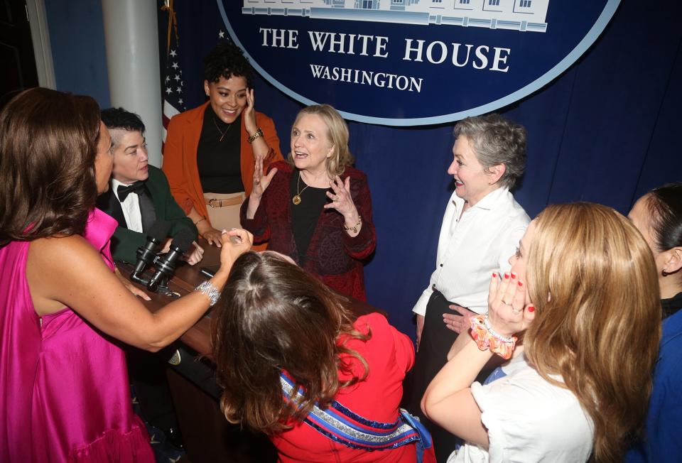 Hillary Clinton chats with the cast backstage at the hit play "POTUS: Or, Behind Every Great Dumbass are Seven Women Trying to Keep Him Alive" on Broadway at The Shubert Theater on July 6, 2022 in New York City.