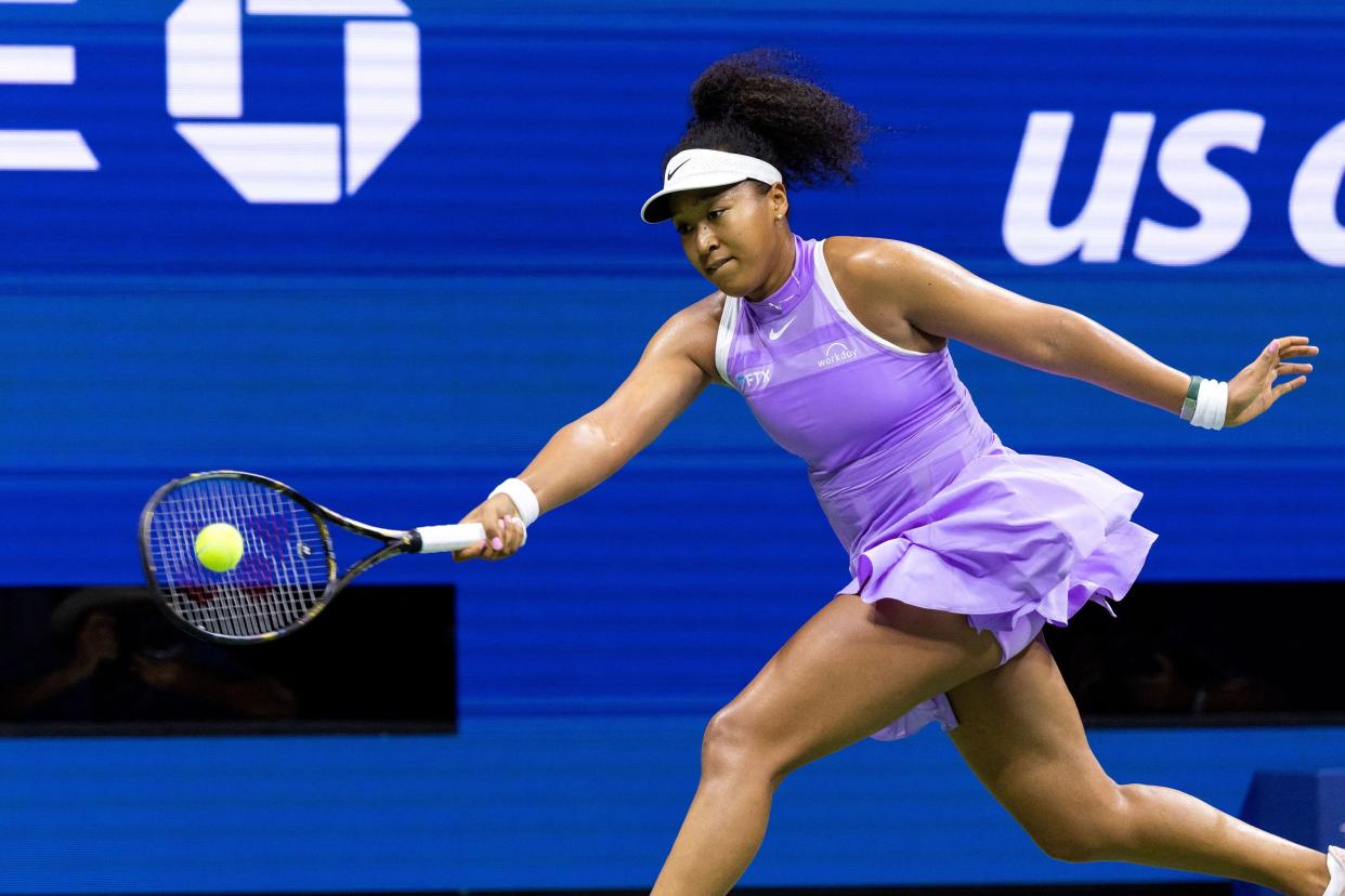 Japan's Naomi Osaka hits a return to USA's Danielle Collins during their 2022 U.S. Open Tennis tournament women's singles first round match at the USTA Billie Jean King National Tennis Center in New York on Aug. 30, 2022.