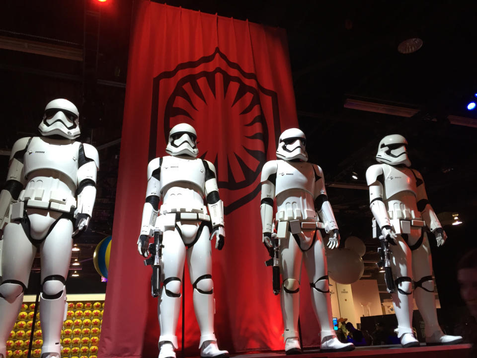 Phasma’s fellow foot soldiers are armed and dangerous, sporting a new look and striking a pose in front of the First Order banner, which hearkens to the old Empire symbol.