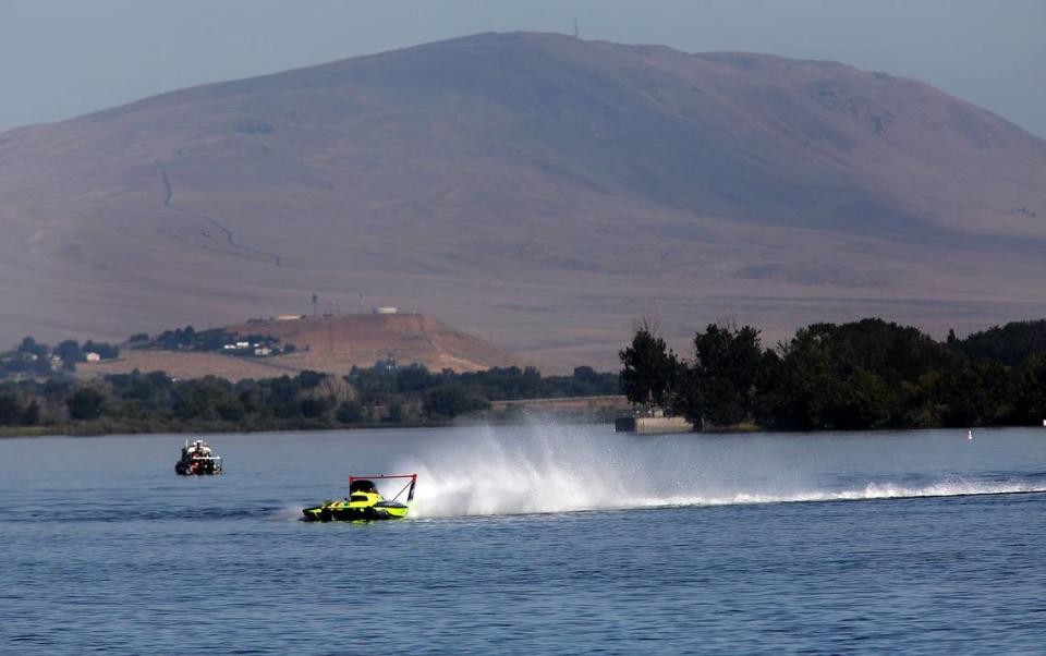 Rattlesnake Mountain looms large as driver Jamie Nilsen pilots the U-11 Legend Yacht Transport presented by The Truss Company unlimited hydroplane around the Coliumbia River during Friday morning’s opening testing session for the three-day Columbia Cup race in the Tri-Cities.