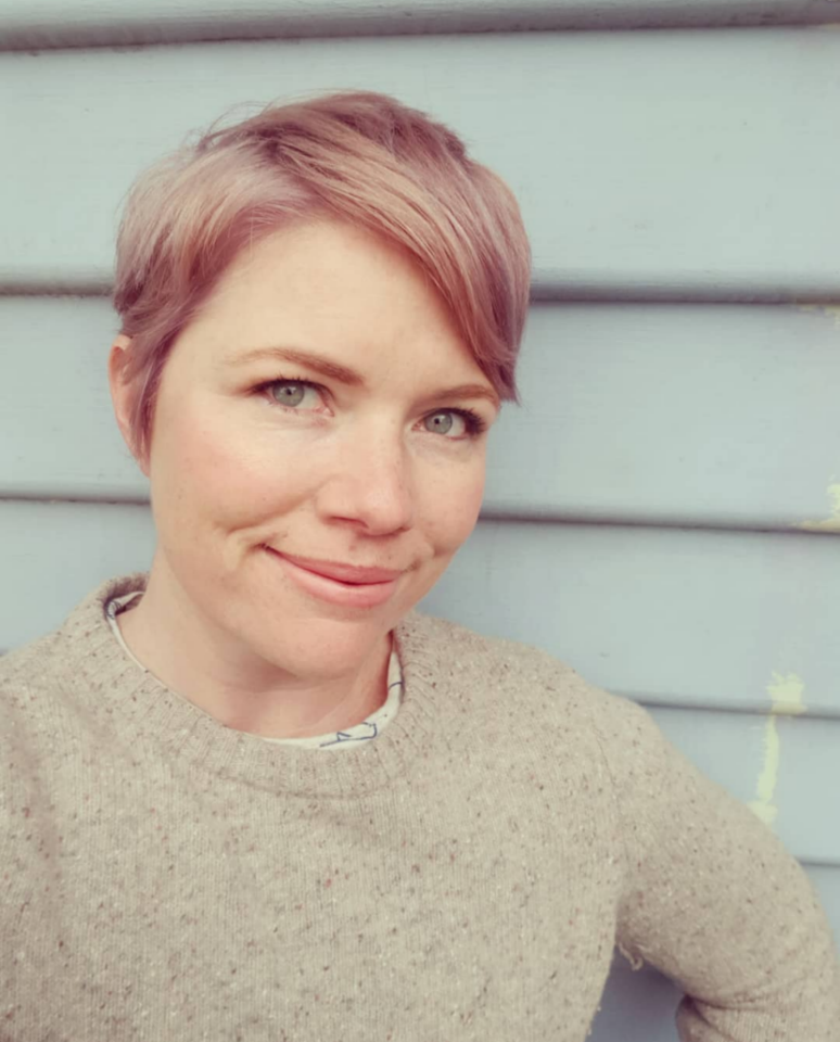 A photo of Clementine Ford wearing a cream jumper.