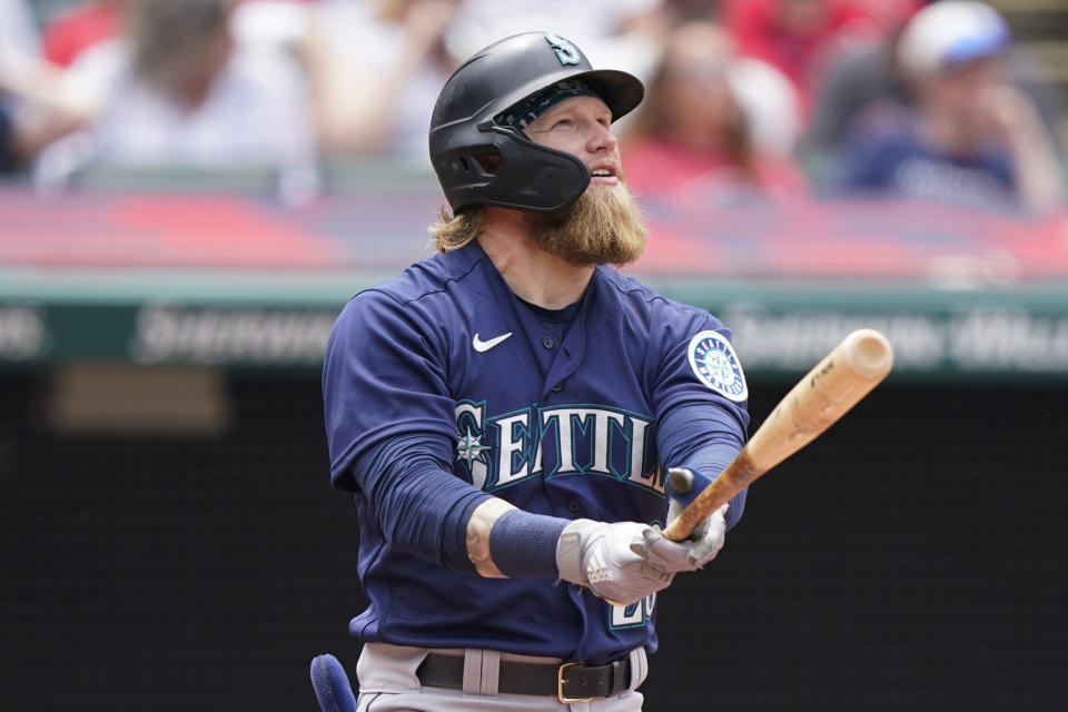 Seattle Mariners' Jake Fraley watches his ball after hitting a two-run home run in the fourth inning of a baseball game against the Cleveland Indians, Sunday, June 13, 2021, in Cleveland. (AP Photo/Tony Dejak)