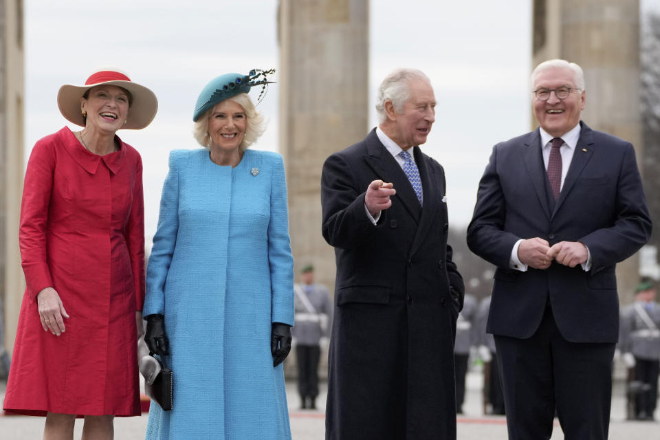 German President Frank-Walter Steinmeier, right, and his wife Elke Buedenbender, left, welcome Britain's King Charles III and Camilla, the Queen Consort, in front of the Brandenburg Gate in Berlin, Wednesday, March 29, 2023. King Charles III arrived Wednesday for a three-day official visit to Germany. (AP Photo/Matthias Schrader)