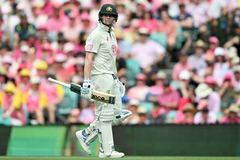 Australia's Steve Smith walks off the field after his dismissal (Saeed KHAN)