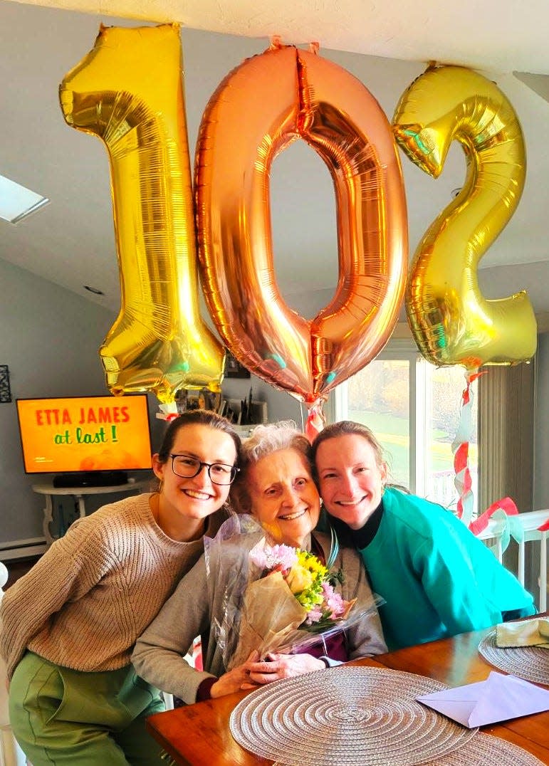 Mary Montminy, center, celebrated her 102nd birthday on Feb. 7, 2024, at her apartment at Hancock Park assisted living in Quincy. Here she is with her 27-year-old twin granddaughters, Julie and Jackie Montminy.