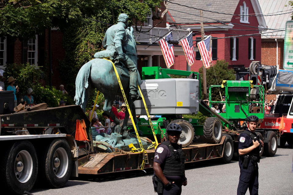  Jackson's statue is placed on a truck as officers stand guard (Ryan M. Kelly / AFP via Getty Images file)
