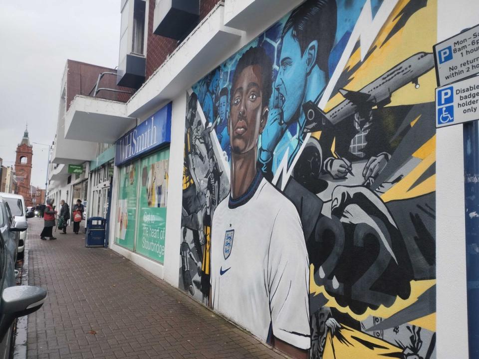 A Bellingham mural has been painted outside a shopping centre in Stourbridge (Zoe Tidman/The Independent)