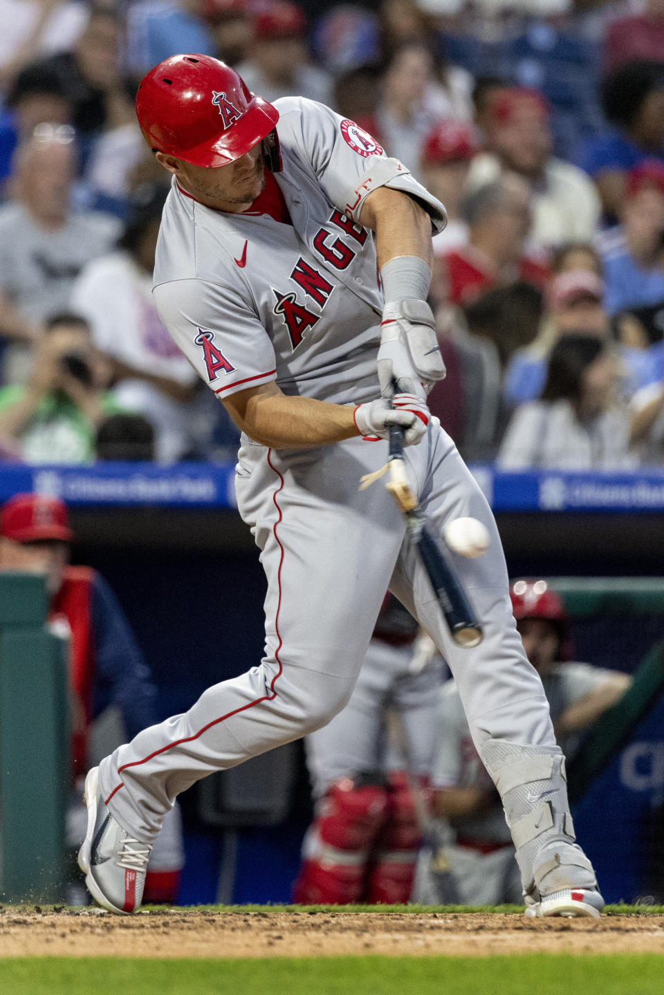 CORRECTS INNING AND RESULT OF AT-BAT - Los Angeles Angels' Mike Trout breaks his bat while hitting a ground ball during the third inning of the team's baseball game against the Philadelphia Phillies, Saturday, June 4, 2022, in Philadelphia. Shohei Ohtani was forced out at second, and Trout reached first. (AP Photo/Laurence Kesterson)